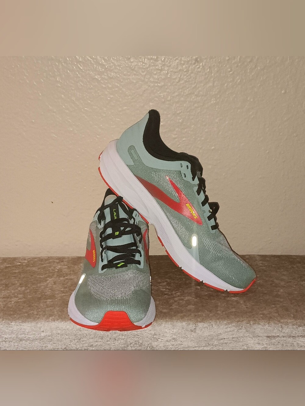 Brooks Launch 9 running shoes in a Blue Surf/Black/Cherry Tomato